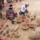 Egyptian excavation workers restore pottery near Kampp 161. (Image: AP)